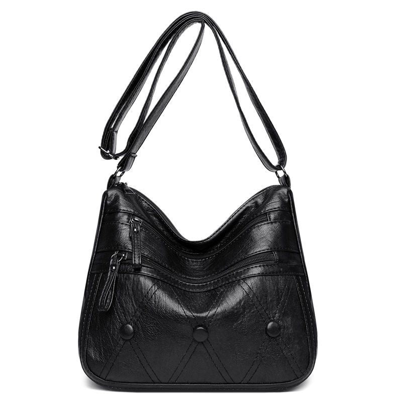 Bolso de piel suave con botones