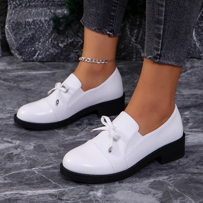Zapatos de piel con lazo y corte bajo